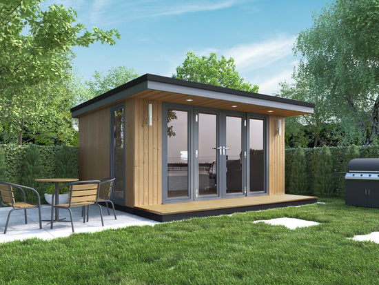 A garden room office with composite cladding and a table and chairs nearby.