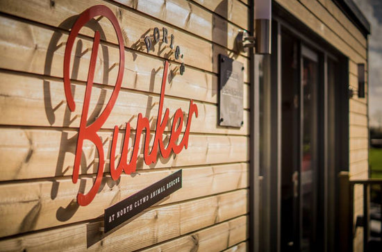 A wooden building with a sign that says butler.